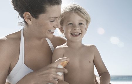 Mom applying protection